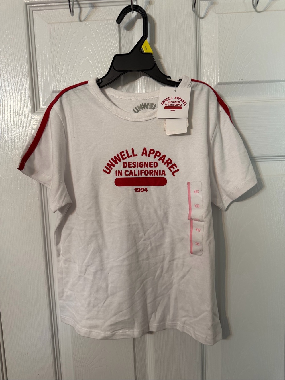 Unwell Apparel White Tee with Red Logo and Shoulder Stripes